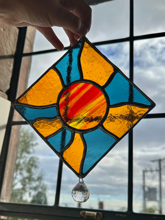 Iridescent blue and orange groovy sun