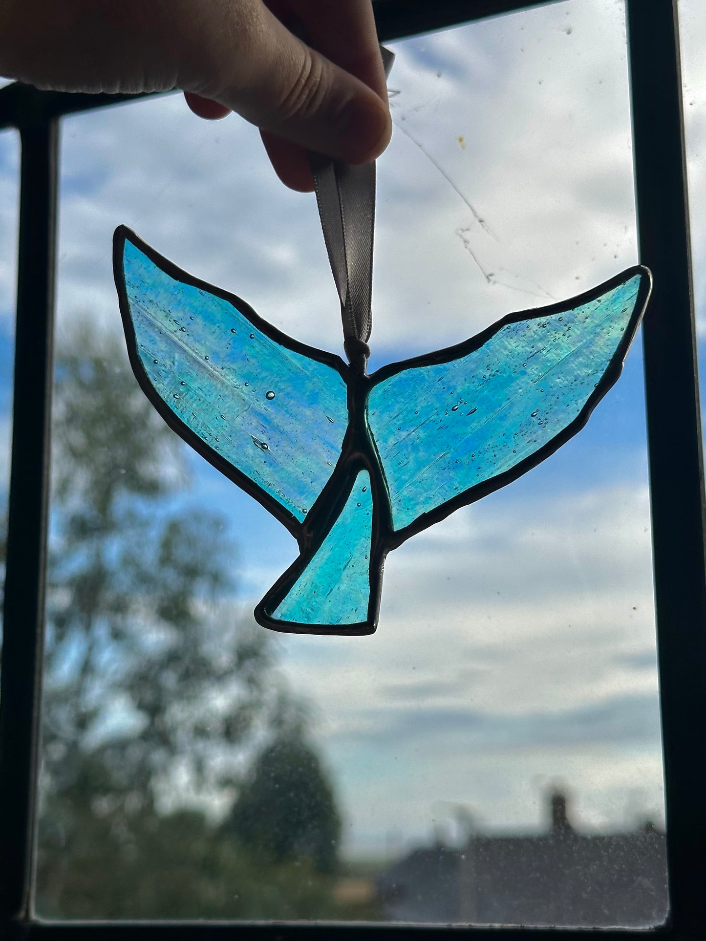 Iridescent whale tail